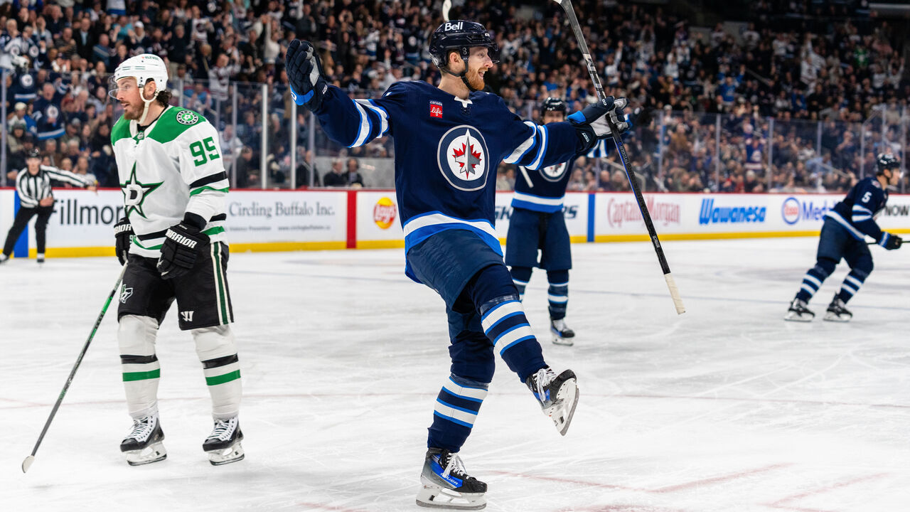 WINNIPEG, CANADA - MARCH 14: Kyle Connor #81 of the Winnipeg Jets celebrating his second goal of the game to make it 3-0 in the second period against the Dallas Stars at Canada Life Centre on March 14, 2025 in Winnipeg, Canada.