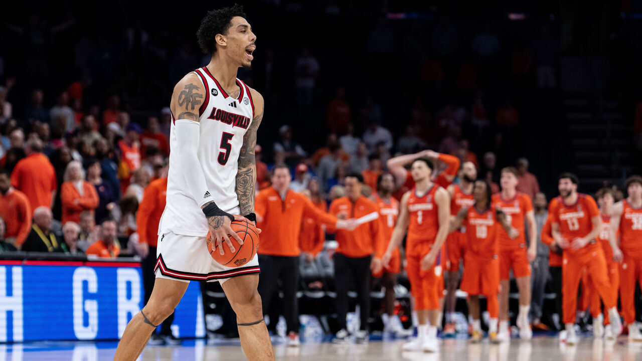 CHARLOTTE, NORTH CAROLINA - MARCH 14: Terrence Edwards Jr. #5 of the Louisville Cardinals celebrates after defeating the Clemson Tigers during the semifinal round of the ACC men's basketball tournament at Spectrum Center on March 14, 2025 in Charlotte, North Carolina.