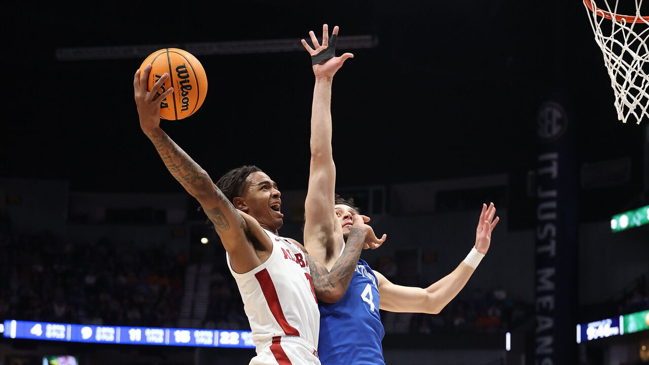 NASHVILLE, TENNESSEE - MARCH 14: Labaron Philon #0 of the Alabama Crimson Tide shoots the ball while defended by Koby Brea #4 of the Kentucky Wildcats during the SEC Men's Basketball Tournament - Quarterfinals at Bridgestone Arena on March 14, 2025 in Nashville, Tennessee. at Bridgestone Arena on March 14, 2025 in Nashville, Tennessee.