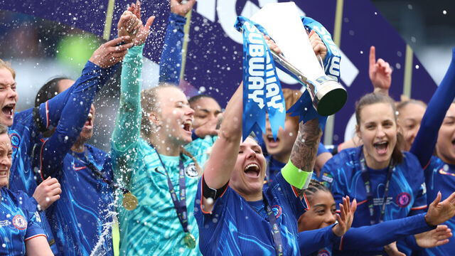DERBY, ENGLAND - MARCH 15: Millie Bright of Chelsea lifts the Subway Women's League Cup after her team's victory in the Subway Women's League Cup Final match between Chelsea and Manchester City at Pride Park on March 15, 2025 in Derby, England.