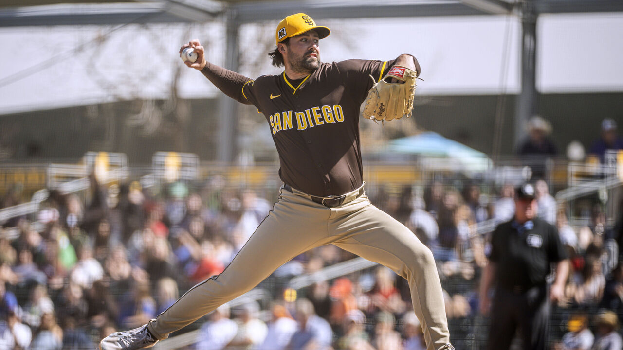 MESA, ARIZONA - FEBRUARY 27: Matt Waldron #61 of the San Diego Padres pitches during a spring training game against the Athletics at HoHoKam Stadium on February 27, 2025 in Mesa, Arizona.