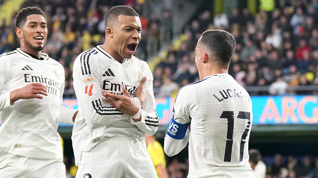 VILLARREAL, SPAIN - MARCH 15: Kylian Mbappe of Real Madrid celebrates scoring his team's second goal with teammates Jude Bellingham and Lucas Vazquez during the LaLiga match between Villarreal CF and Real Madrid CF at Estadio de la Ceramica on March 15, 2025 in Villarreal, Spain.