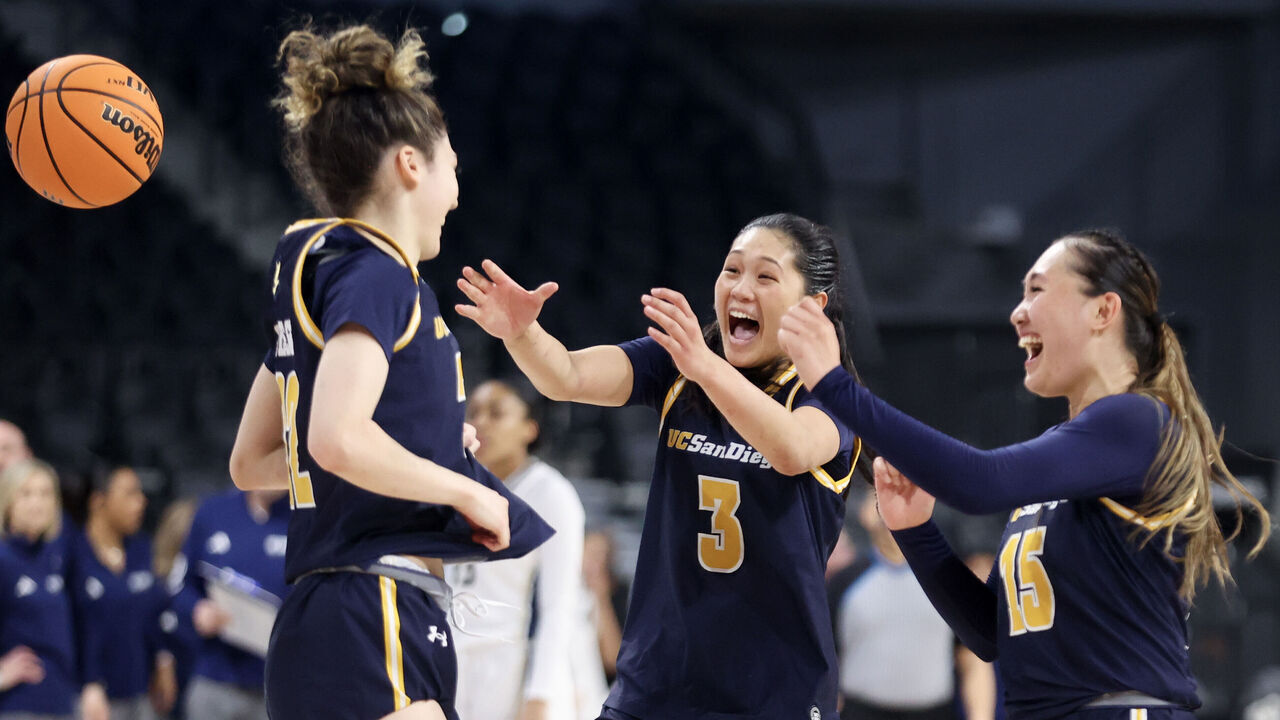 HENDERSON, NEVADA - MARCH 15: Gracie Gallegos #22, Sumayah Sugapong #3, and Sabrina Ma #15 of the UC San Diego Tritons celebrate after their team's 75-66 victory against the UC Davis Aggies to win the Big West Women's Basketball Tournament Championship game at Lee's Family Forum on March 15, 2025 in Henderson, Nevada.