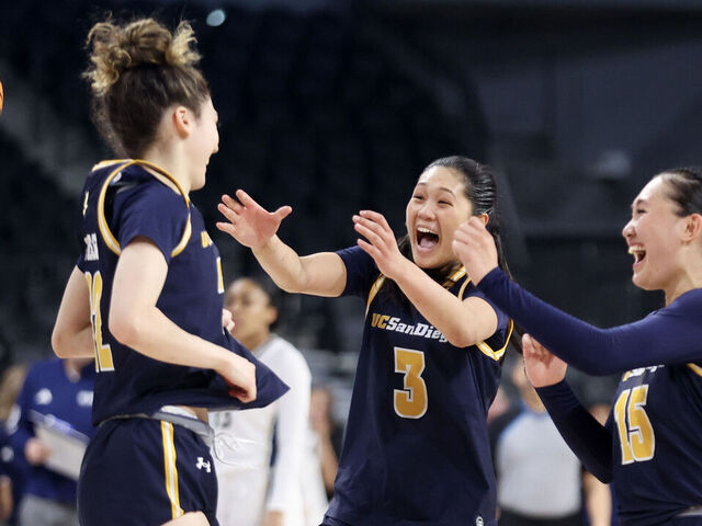 HENDERSON, NEVADA - MARCH 15: Gracie Gallegos #22, Sumayah Sugapong #3, and Sabrina Ma #15 of the UC San Diego Tritons celebrate after their team's 75-66 victory against the UC Davis Aggies to win the Big West Women's Basketball Tournament Championship game at Lee's Family Forum on March 15, 2025 in Henderson, Nevada.