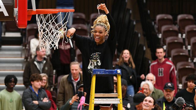 PROVIDENCE, RI - MARCH 15: Harvard Crimson guard Harmoni Turner (14) poses for a photo after cutting a piece of the net following the women's college basketball Ivy League Tournament championship game between the Columbia Lions and the Harvard Crimson on March 15, 2025, at the Pizzitola Sports Center in Providence, RI. The Crimson defeated the Lions 65-63 to win the Ivy League Tournament championship and receive an automatic bid to the NCAA Tournament.