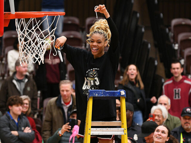 PROVIDENCE, RI - MARCH 15: Harvard Crimson guard Harmoni Turner (14) poses for a photo after cutting a piece of the net following the women's college basketball Ivy League Tournament championship game between the Columbia Lions and the Harvard Crimson on March 15, 2025, at the Pizzitola Sports Center in Providence, RI. The Crimson defeated the Lions 65-63 to win the Ivy League Tournament championship and receive an automatic bid to the NCAA Tournament.