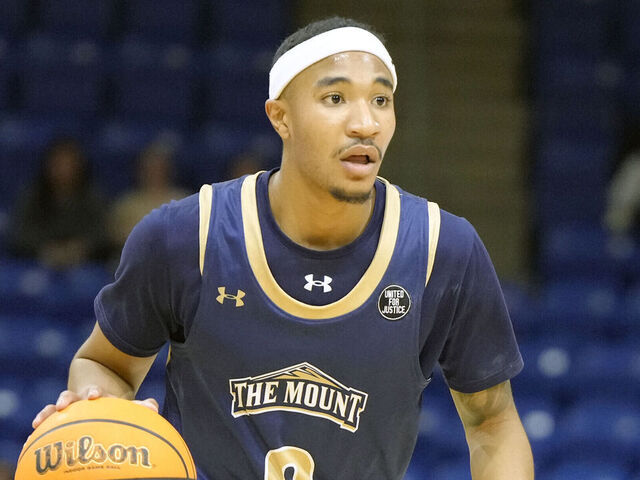 HAMDEN, CT - MACRH 06: Dallas Hobbs #8 of the Mount St. Mary's Mountaineers dribbles up ocurtl during a college basketball game against the Quinnipiac Bobcats at M & T Bank Arena on March 06, 2025 in Hamden, Connecticut.