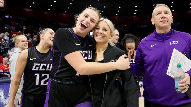 TUCSON, AZ - DECEMBER 05: Grand Canyon Antelopes guard Sydney Erikstrup #11 and head coach Molly Miller celebrate after defeating the Arizona Wildcats 69-66. December 5, 2024 at McKale Center in Tucson, AZ.
