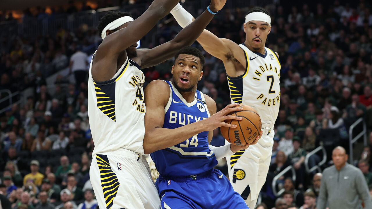 MILWAUKEE, WISCONSIN - MARCH 15: Giannis Antetokounmpo #34 of the Milwaukee Bucks is defended by Pascal Siakam #43 and Andrew Nembhard #2 of the Indiana Pacers during the second half of a game at Fiserv Forum on March 15, 2025 in Milwaukee, Wisconsin.