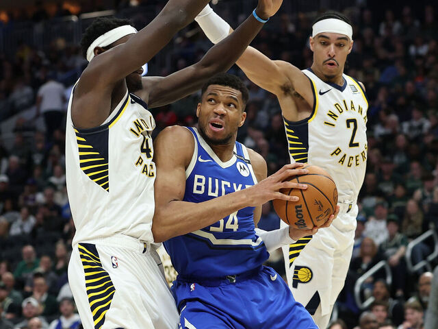 MILWAUKEE, WISCONSIN - MARCH 15: Giannis Antetokounmpo #34 of the Milwaukee Bucks is defended by Pascal Siakam #43 and Andrew Nembhard #2 of the Indiana Pacers during the second half of a game at Fiserv Forum on March 15, 2025 in Milwaukee, Wisconsin.