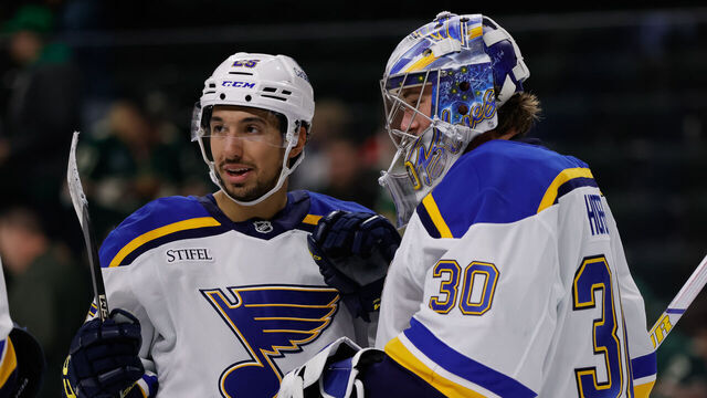 ST. PAUL, MN - MARCH 15: St. Louis Blues goaltender Joel Hofer (30) celebrates with center Jordan Kyrou (25) after winning an NHL game between the St. Louis Blues and Minnesota Wild on March 15th, 2025, at the Xcel Energy Center in St. Paul, MN.
