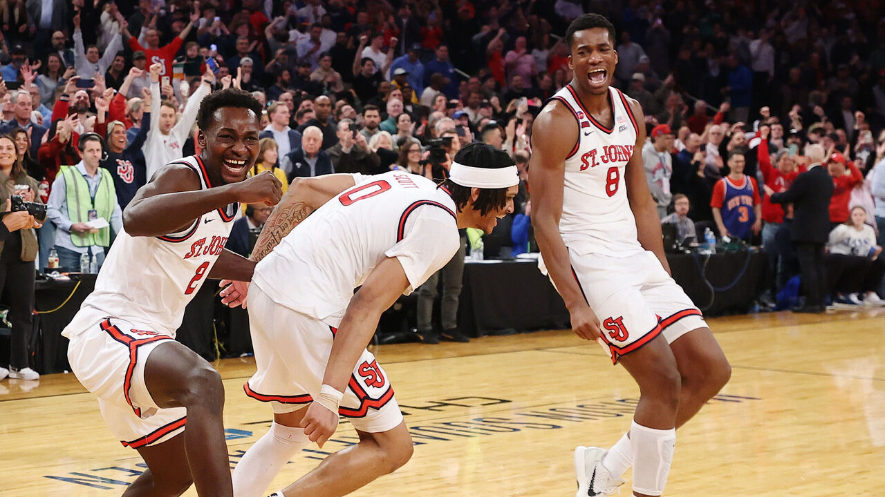 NEW YORK, NEW YORK - MARCH 15: Sadiku Ibine Ayo #2, Aaron Scott #0, and Vince Iwuchukwu #8 of the St. John's Red Storm react in the final seconds of the second half of the championship game against the Creighton Bluejays during the Big East Men's Basketball Tournament at Madison Square Garden on March 15, 2025 in New York City. The Red Storm won 82-66.