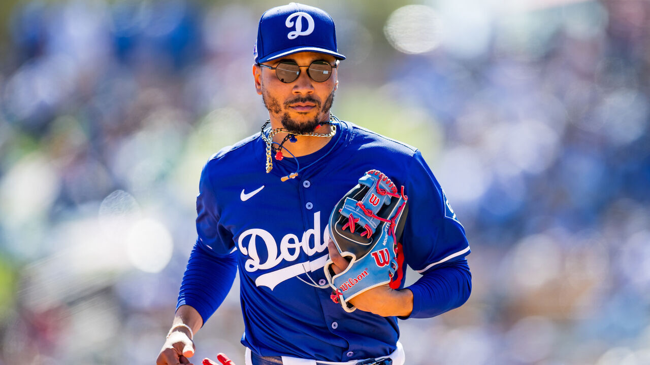 GLENDALE, ARIZONA - MARCH 09: Mookie Betts #50 of the Los Angeles Dodgers runs to the dugout after the top of the fourth inning of a Spring Training game against the Athletics at Camelback Ranch on March 09, 2025 in Glendale, Arizona.