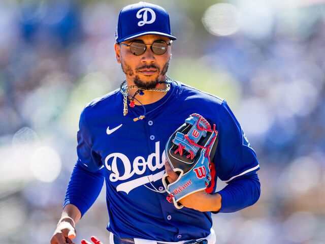 GLENDALE, ARIZONA - MARCH 09: Mookie Betts #50 of the Los Angeles Dodgers runs to the dugout after the top of the fourth inning of a Spring Training game against the Athletics at Camelback Ranch on March 09, 2025 in Glendale, Arizona.