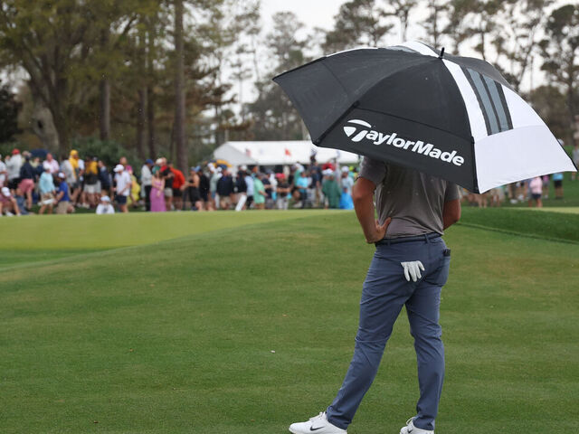 PONTE VEDRA BEACH, FLORIDA - MARCH 16: Rory McIlroy of Northern Ireland stands under an umbrella on the 11th hole during the final round of THE PLAYERS Championship on the Stadium Course at TPC Sawgrass on March 16, 2025 in Ponte Vedra Beach, Florida.