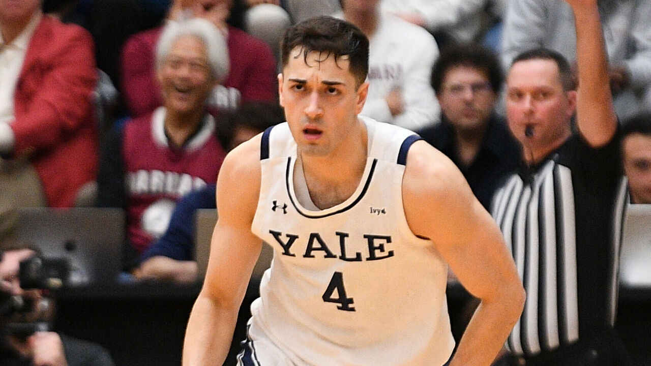 PROVIDENCE, RI - MARCH 15: Yale Bulldogs guard John Poulakidas (4) reacts after scoring during the college basketball Ivy League Tournament semifinal game between the Princeton Tigers and the Yale Bulldogs on March 15, 2025, at the Pizzitola Sports Center in Providence, RI.