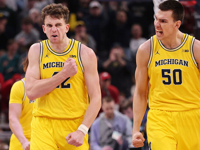 INDIANAPOLIS, INDIANA - MARCH 16: Will Tschetter #42 and Vladislav Goldin #50 of the Michigan Wolverines celebrate against the Wisconsin Badgers during the second half in the Big Ten men's basketball tournament championship at Gainbridge Fieldhouse on March 16, 2025 in Indianapolis, Indiana.