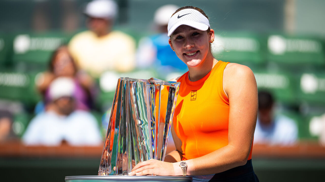 INDIAN WELLS, CALIFORNIA - MARCH 16: Mirra Andreeva poses with the champions trophy after defeating Aryna Sabalenka in the singles final on Final Day of the BNP Paribas Open at Indian Wells Tennis Garden on March 16, 2025 in Indian Wells, California