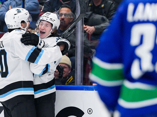 VANCOUVER, CANADA - MARCH 16: Logan Cooley #92 of the Utah Hockey Club celebrates after scoring a goal on Kevin Lankinen #32 of the Vancouver Canucks during the third period of their NHL game at Rogers Arena on March 16, 2025 in Vancouver, British Columbia, Canada.