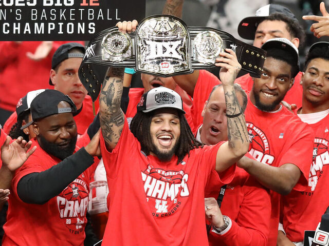 KANSAS CITY, MO - MARCH 15: Houston Cougars guard Emanuel Sharp (21) holds up the Most Outstanding Player belt after winning the Big 12 tournament final between the Arizona Wildcats and Houston Cougars on March 15, 2025 at T-Mobile Center in Kansas City, MO.