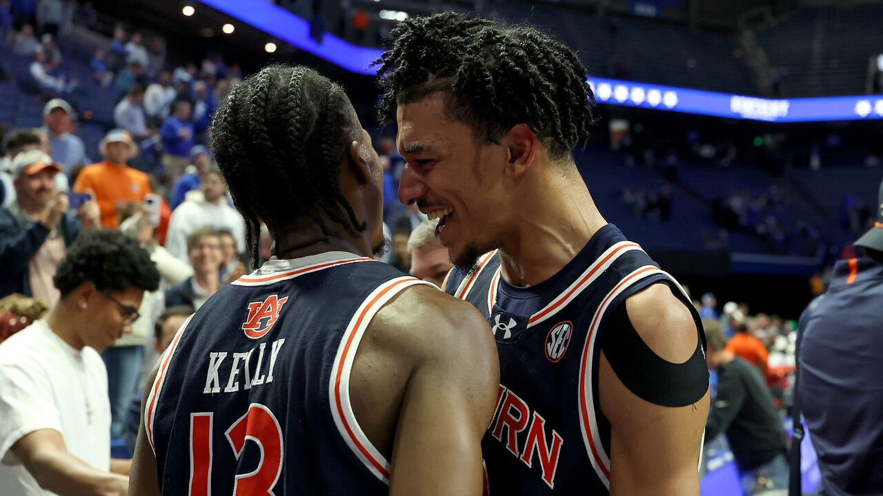 LEXINGTON, KENTUCKY - MARCH 01: Chad Baker-Mazara #10 and Miles Kelly #13 of the Auburn Tigers celebrate after the 94-78 win against the Kentucky Wildcats at Rupp Arena on March 01, 2025 in Lexington, Kentucky.