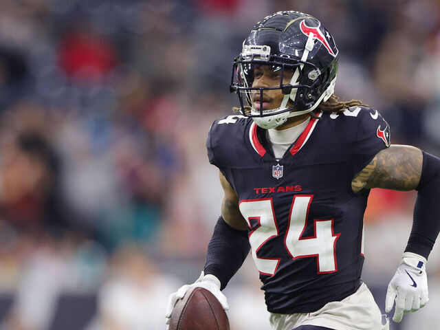 HOUSTON, TEXAS - DECEMBER 15: Derek Stingley Jr. #24 of the Houston Texans runs the ball against the Miami Dolphins during the second half at NRG Stadium on December 15, 2024 in Houston, Texas.