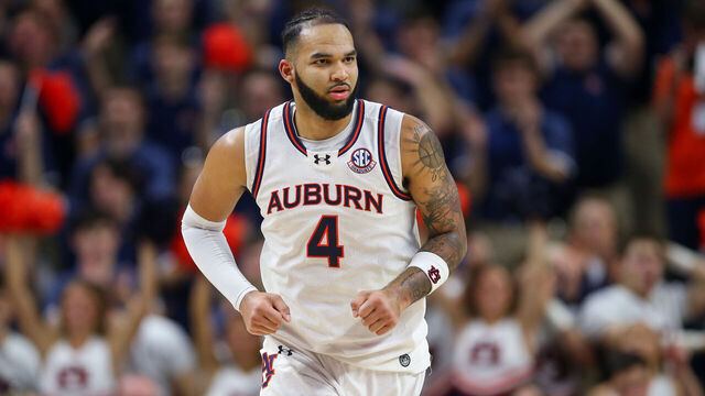 AUBURN, ALABAMA - MARCH 8: Johni Broome #4 of the Auburn Tigers runs back to defend during the first half against the Alabama Crimson Tide at Neville Arena on March 8, 2025 in Auburn, Alabama.