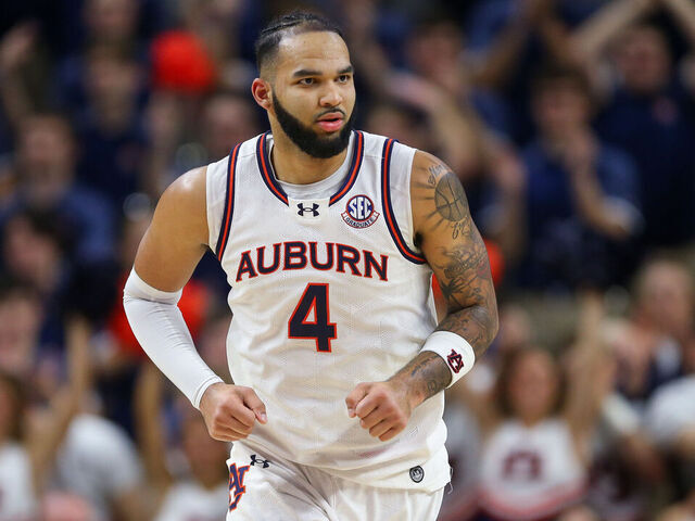 AUBURN, ALABAMA - MARCH 8: Johni Broome #4 of the Auburn Tigers runs back to defend during the first half against the Alabama Crimson Tide at Neville Arena on March 8, 2025 in Auburn, Alabama.