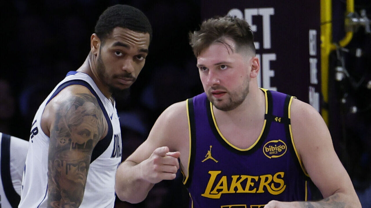 Los Angeles, CA - February 25: Lakers point guard Luka Doncic, #77, right, points to teammate LeBron James after scoring as Dallas Mavericks forward P.J. Washington, 25, watches in the second half at Crypto.com Arena in Los Angeles Tuesday, Feb. 25, 2025. (Allen J. Schaben / Los Angeles Times via Getty Images)