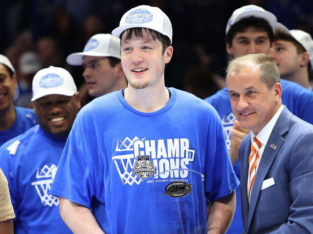 CHARLOTTE, NC - MARCH 15: Duke Blue Devils guard Kon Knueppel (7) gets the MVP trophy of the tournament presented by ACC commissioner Jim Phillips during the ACC Men's basketball tournament championship game between the Louisville Cardinals and the Duke Blue Devils on March 15, 2025 at the Spectrum Center in Charlotte, N.C.