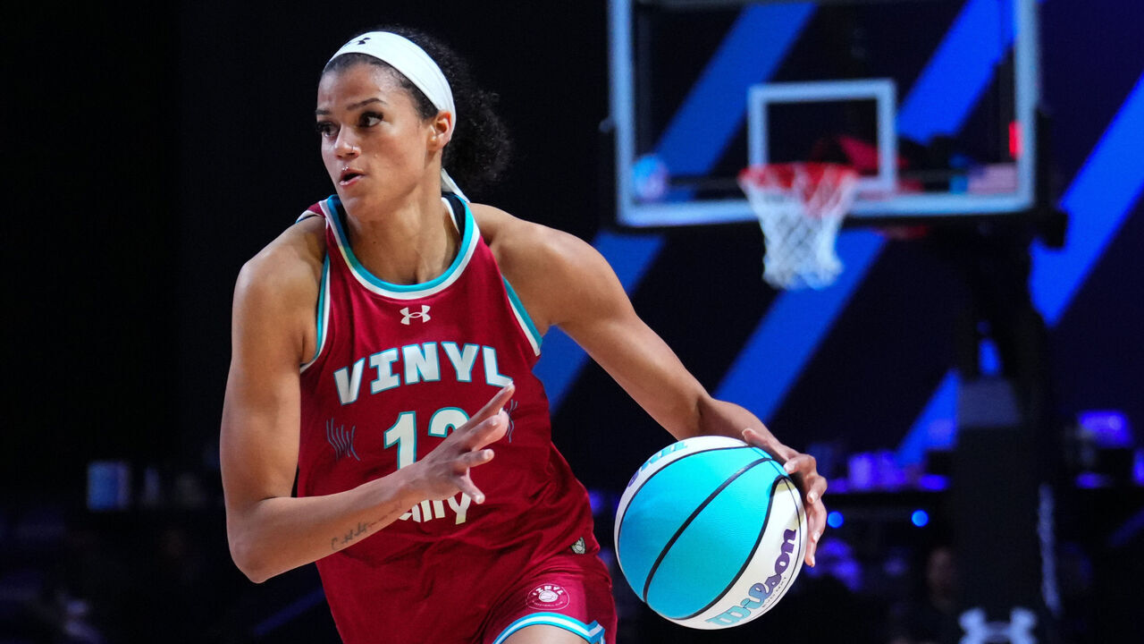 MEDLEY, FLORIDA - FEBRUARY 21: Rae Burrell #12 of the Vinyl dribbles the ball against Courtney Vandersloot #25 of the Mist during the second half at Wayfair Arena on February 21, 2025 in Medley, Florida.