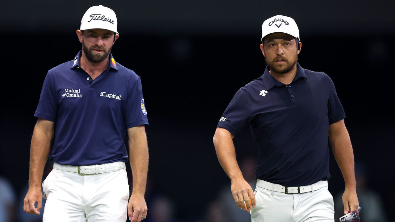 PALM BEACH GARDENS, FLORIDA - MARCH 17: Cameron Young and Xander Schauffele of New York Golf Club look on from the fourth green during their TGL presented by SoFi match against the Los Angeles Golf Club at SoFi Center on March 17, 2025 in Palm Beach Gardens, Florida.