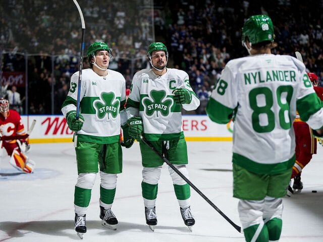 TORONTO, ON - MARCH 17: Auston Matthews #34 celebrates scoring a goal with Matthew Knies #23 and William Nylander #88 of the Toronto Maple Leafs during the second period against the Calgary Flames at the Scotiabank Arena on March 17, 2025 in Toronto, Ontario, Canada.