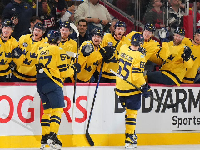 MONTREAL, QUEBEC - FEBRUARY 15: (L-R) Rickard Rakell #67 and Erik Karlsson #65 of Team Sweden skate by the team bench to celebrate with teammates after Karlsson scored a goal during the second period of the 4 Nations Face-Off game between Finland and Sweden at Bell Centre on February 15, 2025 in Montreal, Quebec.