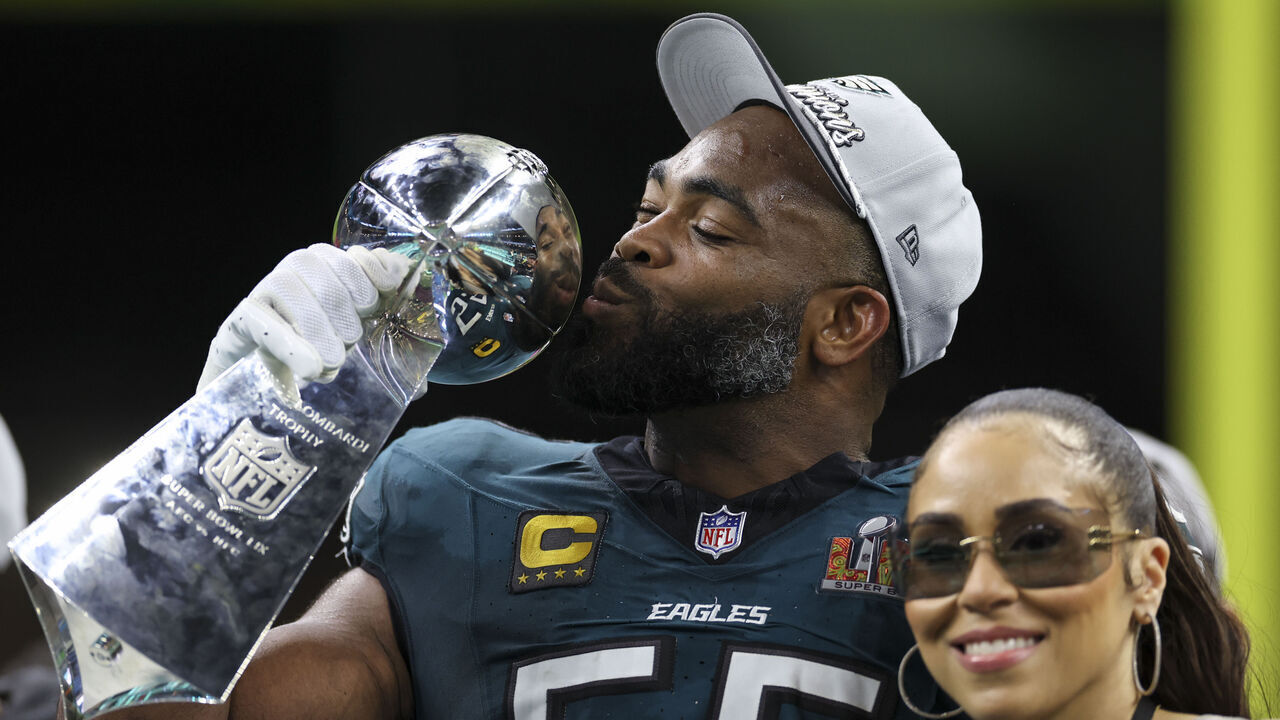 NEW ORLEANS, LOUISIANA - FEBRUARY 09: Brandon Graham #55 of the Philadelphia Eagles kisses the Vince Lombardi Trophy after winning Super Bowl LIX against the Kansas City Chiefs at Caesars Superdome on February 09, 2025, in New Orleans, Louisiana. The Eagles defeated the Chiefs 40-22. (Kara Durrette/Getty Images)
