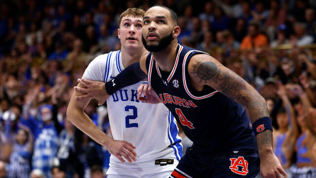 DURHAM, NORTH CAROLINA - DECEMBER 4: Johni Broome #4 of the Auburn Tigers boxes out against Cooper Flagg #2 of the Duke Blue Devils during the first half of the game at Cameron Indoor Stadium on December 4, 2024 in Durham, North Carolina.