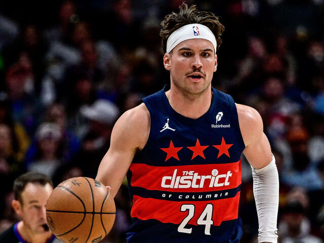DENVER, COLORADO - MARCH 15: Corey Kispert #24 of the Washington Wizards dribbles against the Denver Nuggets in the first half at Ball Arena on March 15, 2025 in Denver, Colorado.