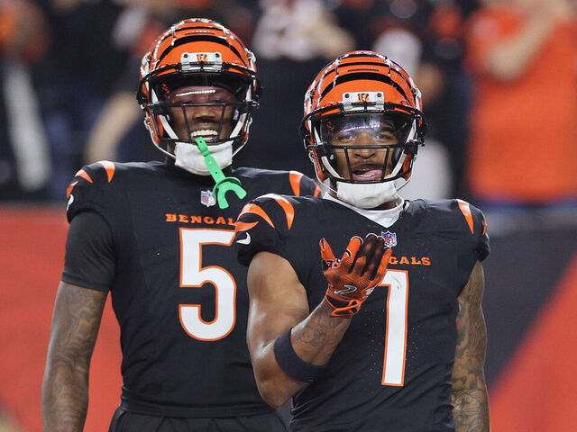 CINCINNATI, OHIO - SEPTEMBER 23: Ja'Marr Chase #1and Tee Higgins #5 of the Cincinnati Bengals celebrate after Chase scored a touchdown against the Washington Commanders at Paycor Stadium on September 23, 2024 in Cincinnati, Ohio.