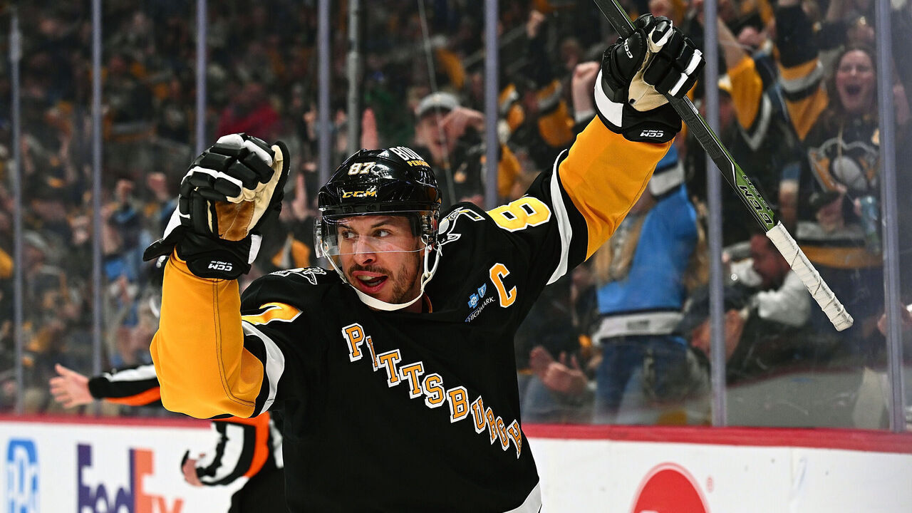 PITTSBURGH, PA - MARCH 18: Sidney Crosby #87 of the Pittsburgh Penguins celebrate his first period goal against the New York Islanders at PPG PAINTS Arena on March 18, 2025 in Pittsburgh, Pennsylvania.