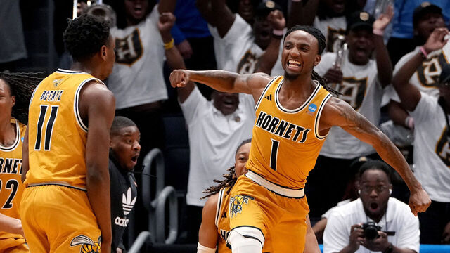 DAYTON, OHIO - MARCH 18: Amarr Knox #1 of the Alabama State Hornets celebrates with teammates after making the final shot during the second half in the First Four game of the NCAA Men's Basketball Tournament at University of Dayton Arena on March 18, 2025 in Dayton, Ohio.