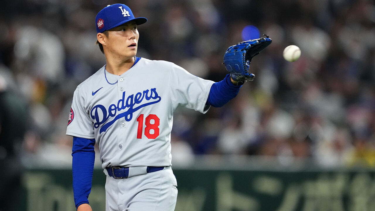 TOKYO, JAPAN - MARCH 18: Yoshinobu Yamamoto #18 of the Los Angeles Dodgers reacts in the bottom of the fourth inning during the MLB Tokyo Series games against Chicago Cubs at Tokyo Dome on March 18, 2025 in Tokyo, Japan.