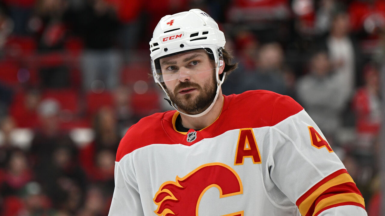 RALEIGH, NC - MARCH 02: Calgary Flames defenseman Rasmus Andersson (4) prepares for a faceoff during the NHL game between the Calgary Flames and the Carolina Hurricanes on March 2, 2025 at Lenovo Center in Raleigh, North Carolina.