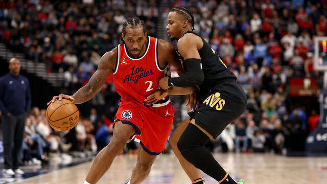 INGLEWOOD, CALIFORNIA - MARCH 18: Kawhi Leonard #2 of the Los Angeles Clippers drives to the basket against Isaac Okoro #35 of the Cleveland Cavaliers during the fourth quarter at Intuit Dome on March 18, 2025 in Inglewood, California.