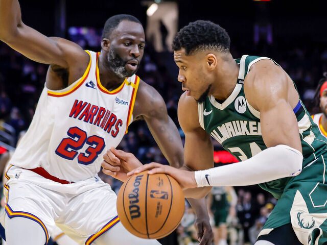 Draymond Green (23) defends against Giannis Antetokounmpo (34) in the second half as the Golden State Warriors played the Milwaukee Bucks at Chase Center in San Francisco, on Tuesday, March 18, 2025.