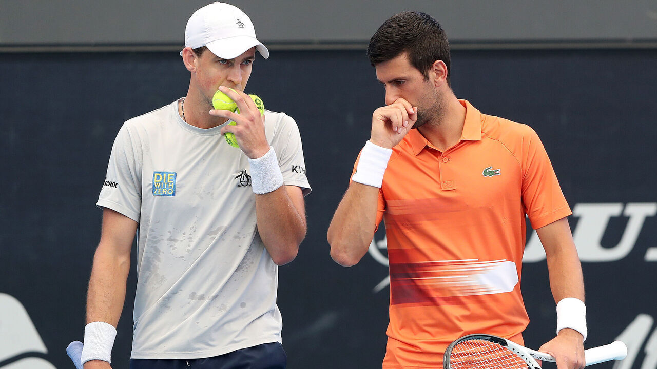 ADELAIDE, AUSTRALIA - JANUARY 02: Novak Djokovic of Serbia and Vasek Pospisil of Canada compete against against Tomislav Brkic of Bosnia and Herzegovina and Gonzalo Escobar of Ecuador during day two of the 2023 Adelaide International at Memorial Drive on January 02, 2023 in Adelaide, Australia.