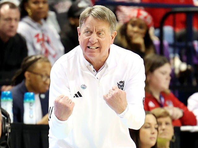 GREENSBORO, NORTH CAROLINA - MARCH 09: Head coach Wes Moore of the NC State Wolfpack yells out a play to team during the ACC Women's Basketball Tournament Championship Game against the Duke Blue Devils at Greensboro Coliseum Complex on March 09, 2025 in Greensboro, North Carolina.
