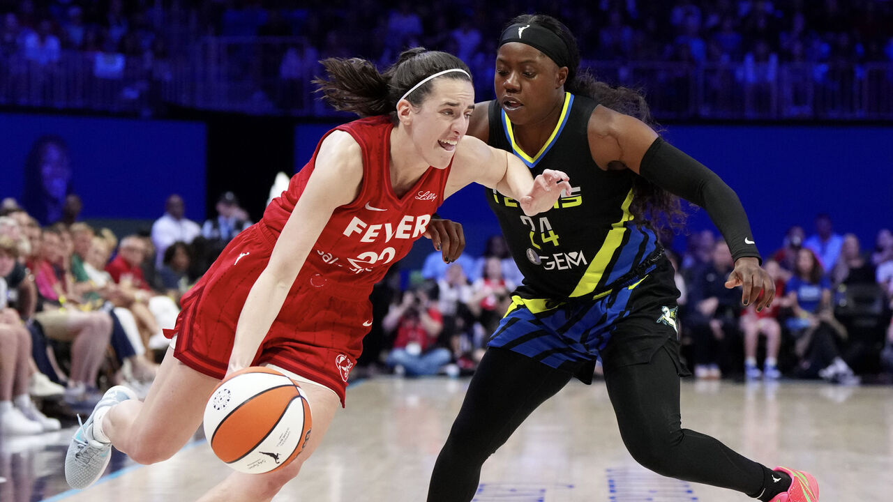 ARLINGTON, TEXAS - SEPTEMBER 01: Caitlin Clark #22 of the Indiana Fever is defended by Arike Ogunbowale #24 of the Dallas Wings during the second half at College Park Center on September 01, 2024 in Arlington, Texas.