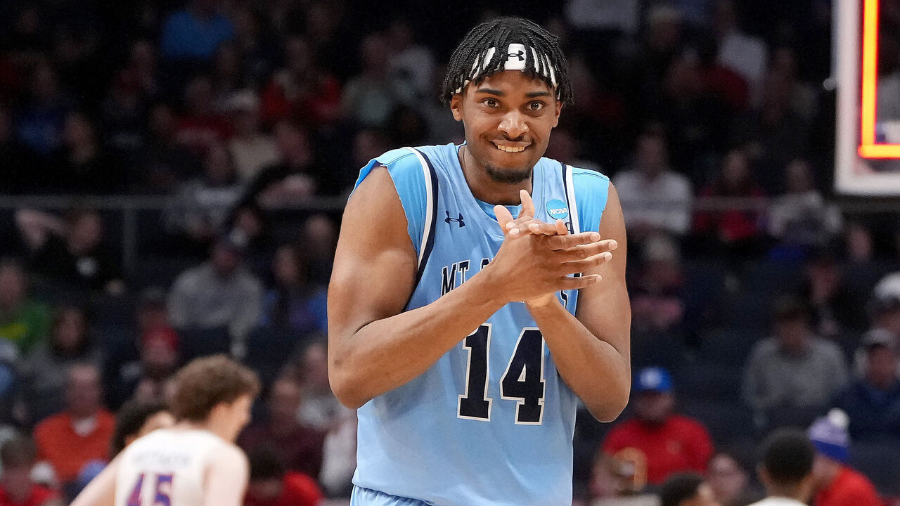 DAYTON, OHIO - MARCH 19: Jedy Cordilia #14 of the Mount St. Mary's Mountaineers celebrates a basket against the American University Eagles during the first half in the First Four game of the NCAA Men's Basketball Tournament at University of Dayton Arena on March 19, 2025 in Dayton, Ohio.