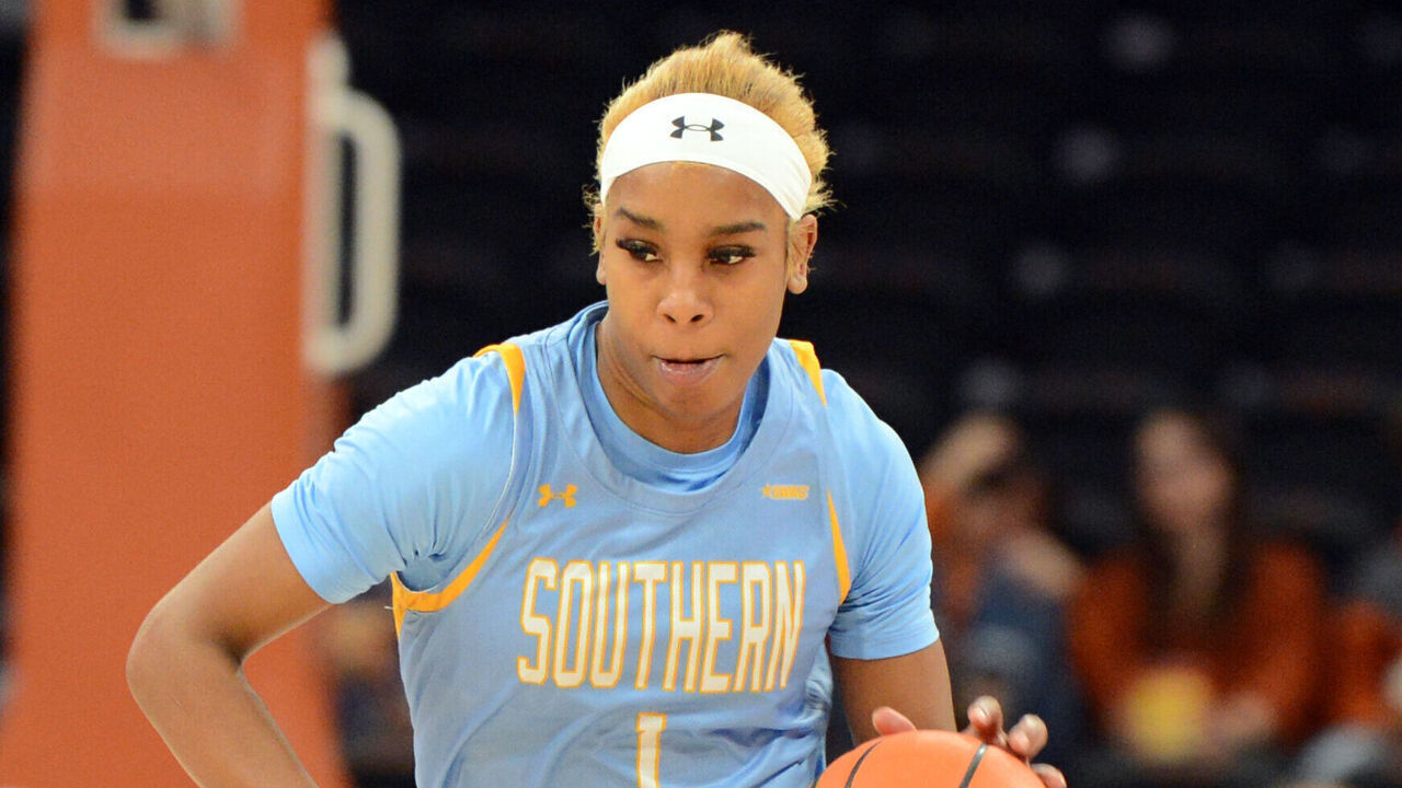 AUSTIN, TX - DECEMBER 11: Southern University Jaguars guard Aniya Gourdine (1) is chased by Texas Longhorns guard Rori Harmon during game featuring the Southern University Jaguars and Texas Longhorns on December 11, 2024, at the Moody Center in Austin, TX.