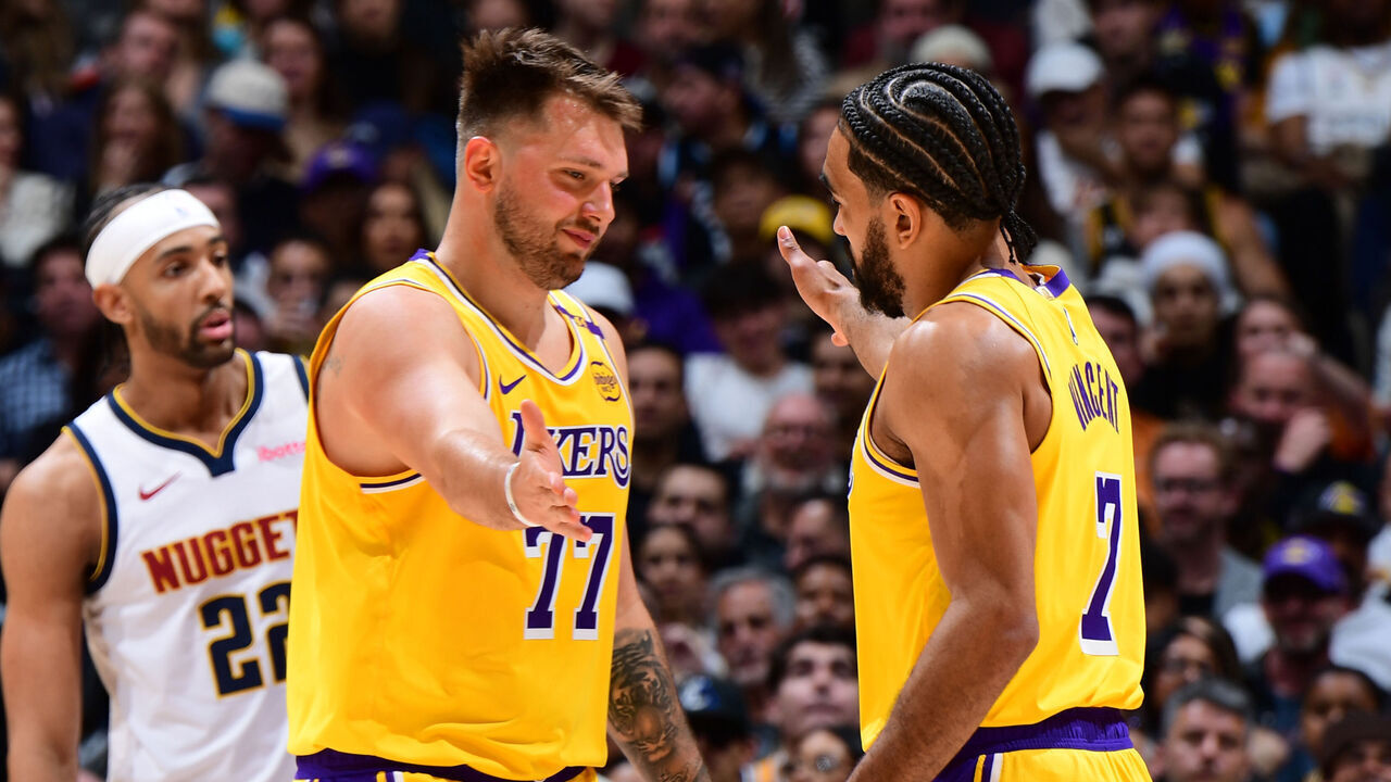 LOS ANGELES, CA - MARCH 19: Luka Doncic #77 high fives Gabe Vincent #7 of the Los Angeles Lakers during the game against the Denver Nuggets on March 19, 2025 at Crypto.Com Arena in Los Angeles, California. NOTE TO USER: User expressly acknowledges and agrees that, by downloading and/or using this Photograph, user is consenting to the terms and conditions of the Getty Images License Agreement. Mandatory Copyright Notice: Copyright 2025 NBAE